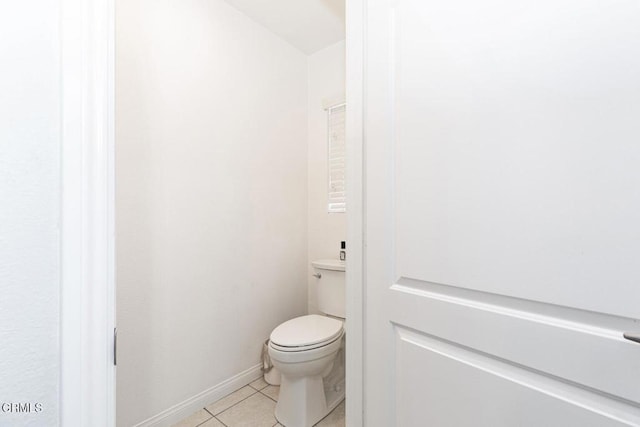 bathroom with tile patterned flooring and toilet