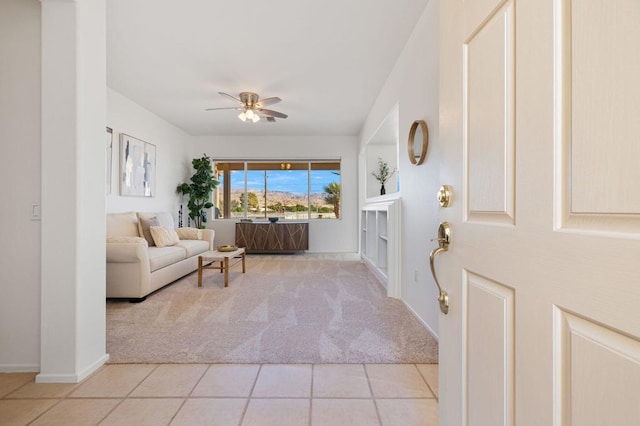 interior space featuring ceiling fan and light tile patterned flooring