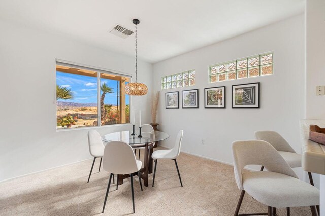 view of carpeted dining space