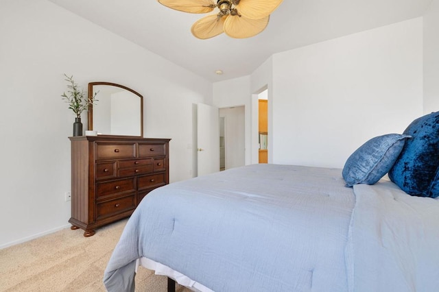 bedroom featuring ceiling fan and light carpet