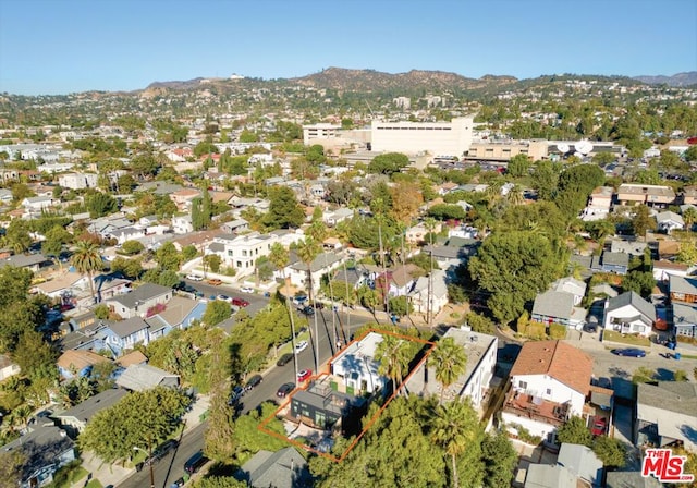 birds eye view of property featuring a mountain view