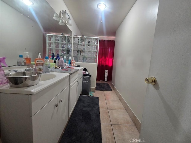 bathroom with vanity and tile patterned flooring