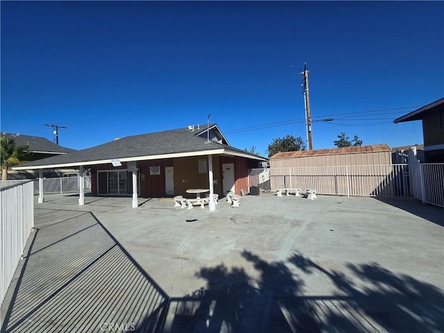 back of property featuring a patio