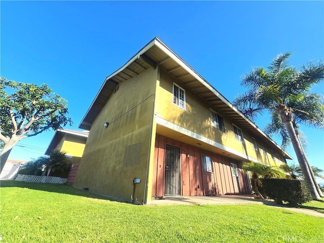 view of home's exterior with a yard