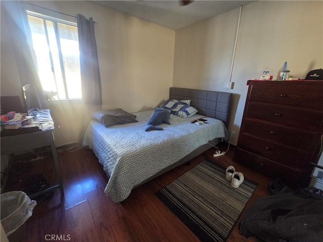 bedroom featuring dark wood-type flooring