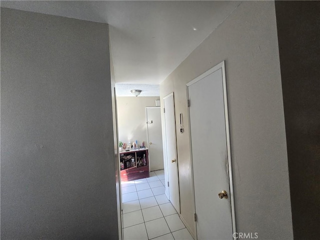 hallway with light tile patterned floors