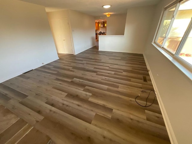 empty room featuring dark hardwood / wood-style floors