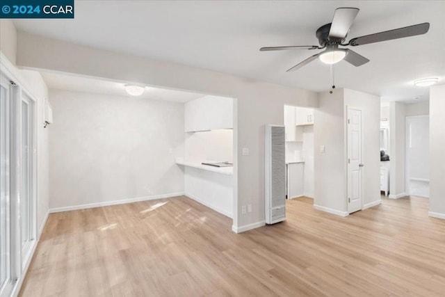 interior space with ceiling fan and light hardwood / wood-style floors