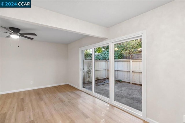 spare room featuring ceiling fan and light hardwood / wood-style flooring