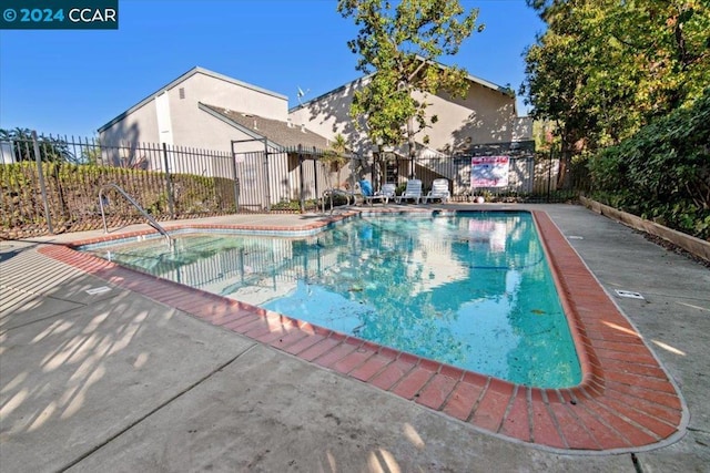 view of swimming pool featuring a patio