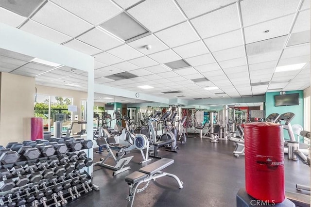 workout area with a paneled ceiling