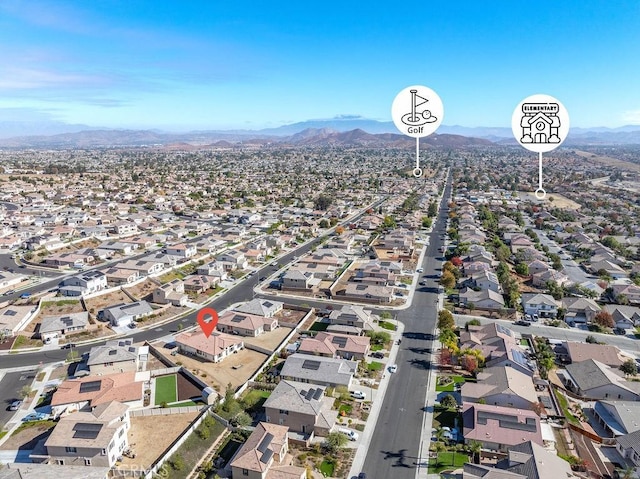 birds eye view of property with a mountain view