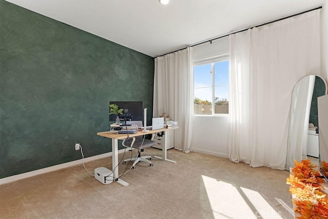 office area featuring light colored carpet