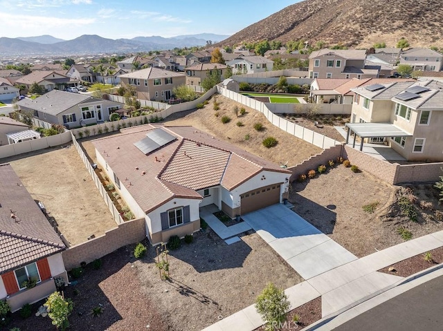 birds eye view of property with a mountain view