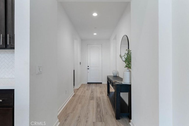 corridor featuring light hardwood / wood-style floors