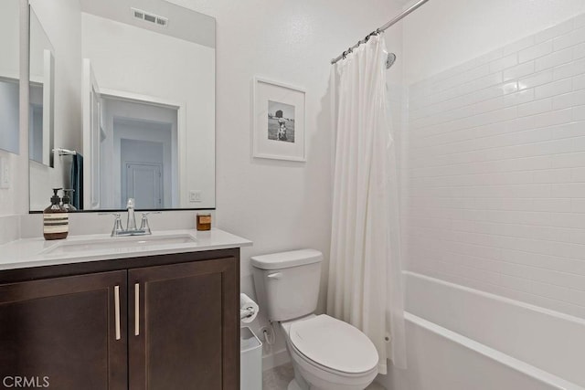 full bathroom featuring vanity, toilet, and shower / bath combo with shower curtain