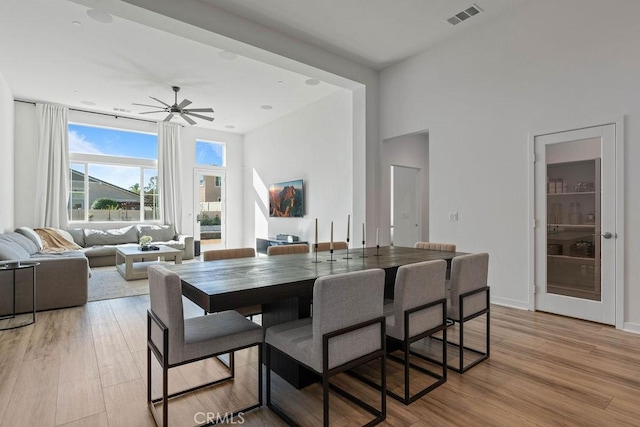 dining area featuring ceiling fan and light hardwood / wood-style floors