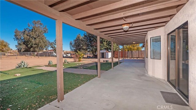 view of patio / terrace featuring a shed