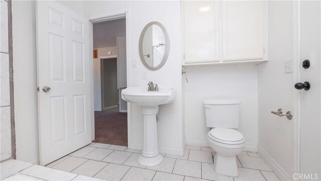 bathroom featuring tile patterned floors and toilet