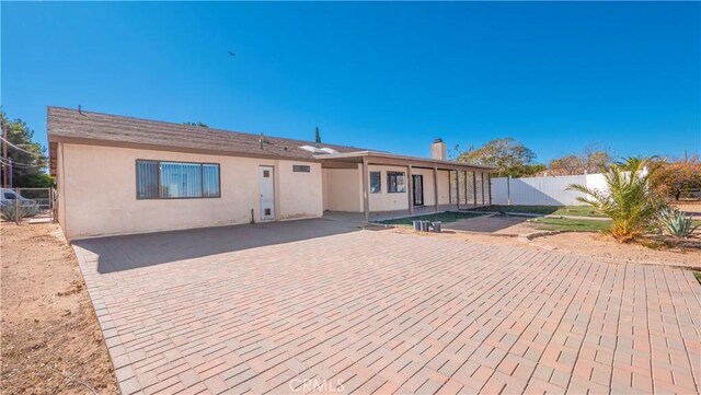 rear view of property with a patio area