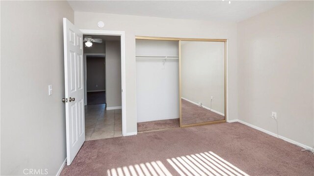 unfurnished bedroom featuring a closet and carpet