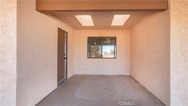 doorway to property featuring a patio area