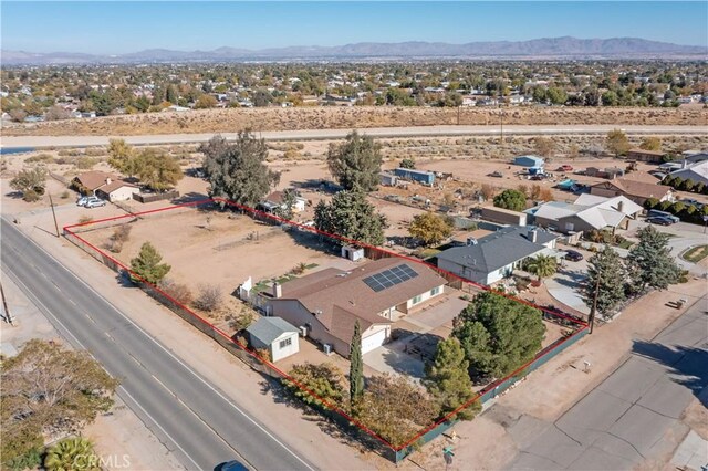 birds eye view of property with a mountain view