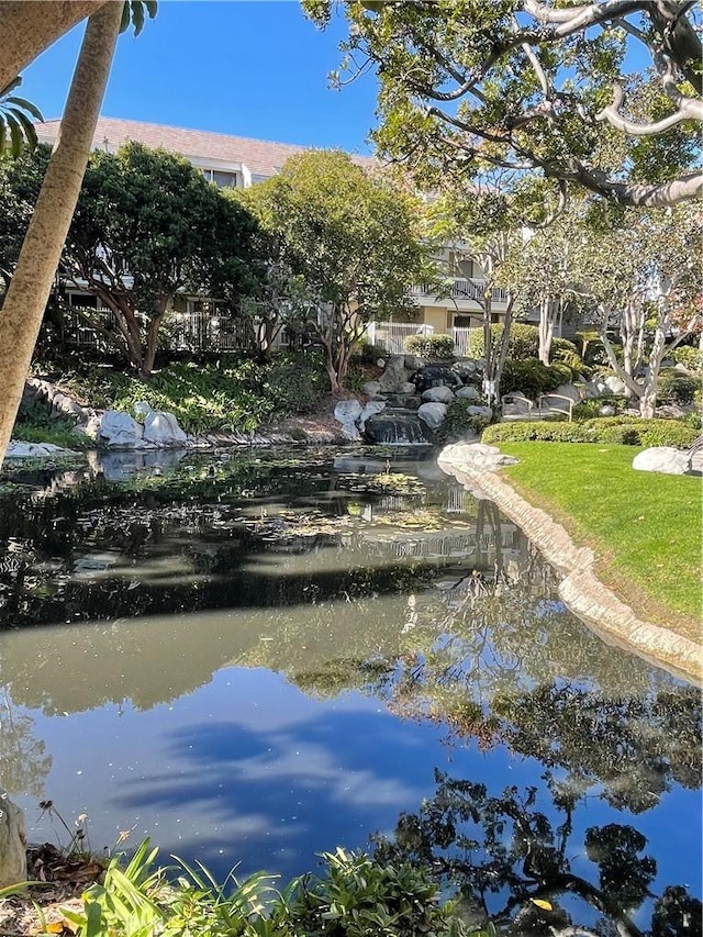 view of community with a water view