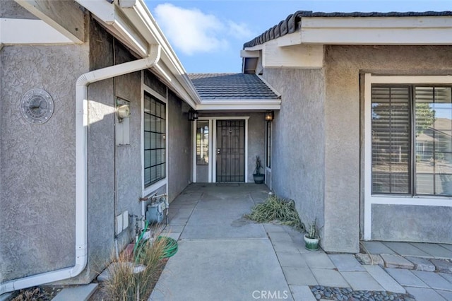 entrance to property with a patio area