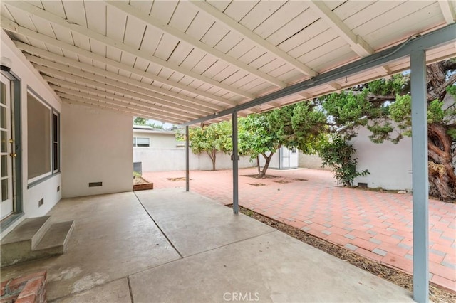 view of patio featuring a shed