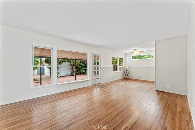 unfurnished living room featuring light wood-type flooring and ceiling fan