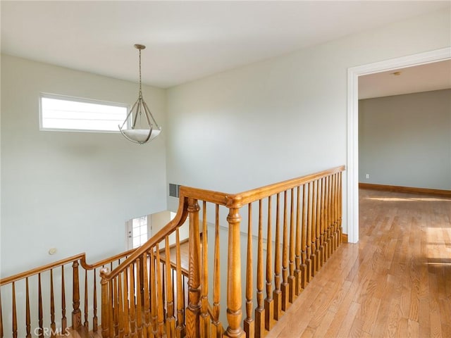 stairs featuring wood-type flooring