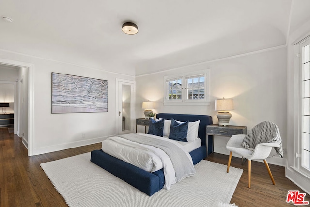 bedroom featuring dark hardwood / wood-style floors