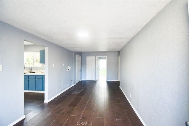 interior space with wood tiled floor and baseboards