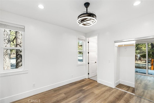 unfurnished bedroom featuring hardwood / wood-style flooring and a closet