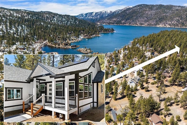 birds eye view of property with a water and mountain view