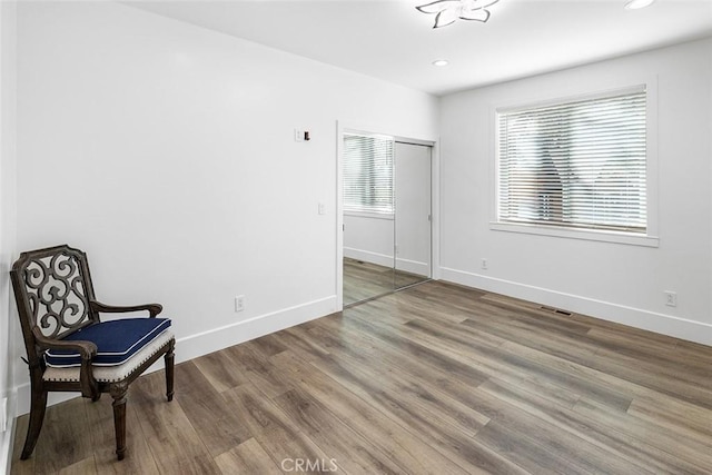 sitting room featuring hardwood / wood-style floors