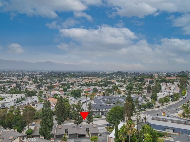 birds eye view of property featuring a mountain view