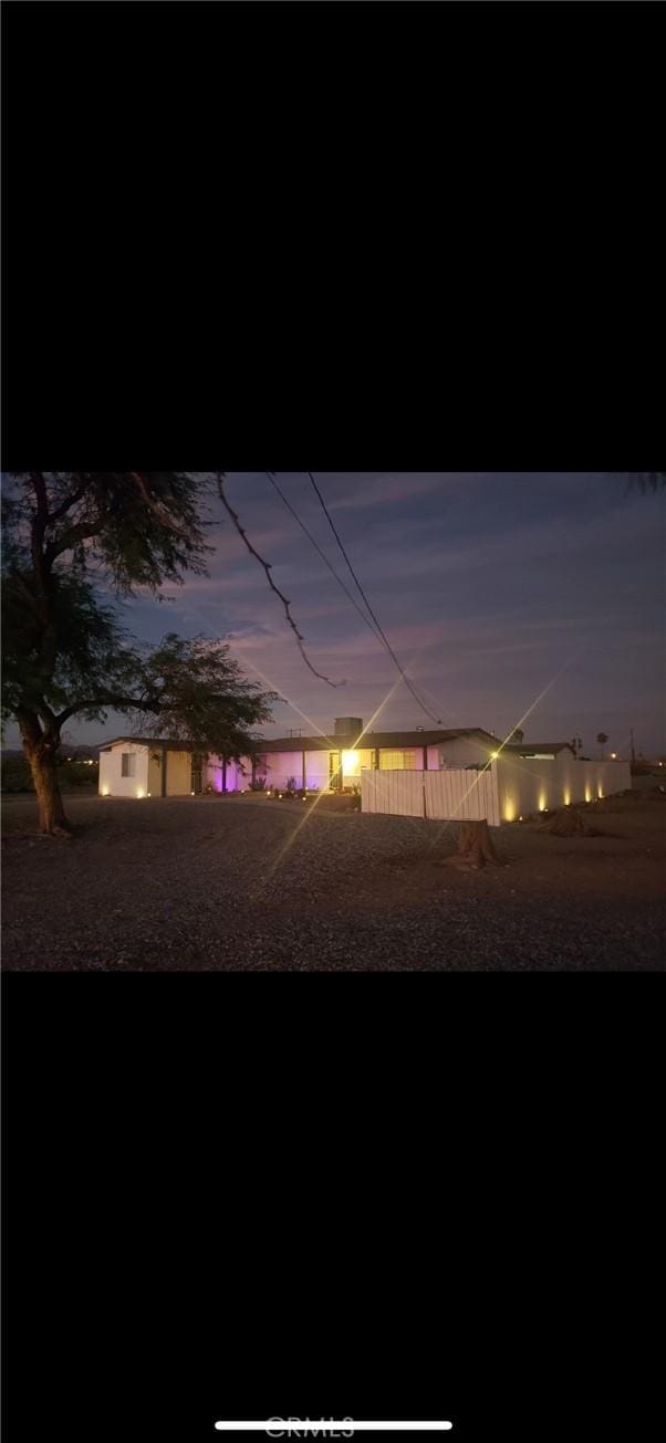 view of yard at dusk