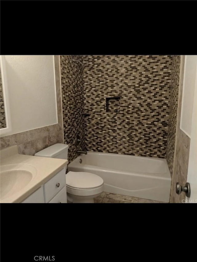 150136 Del Rey Dr, Big River, CA 92242 - full bathroom featuring vanity, toilet, tile walls, and tiled shower / bath