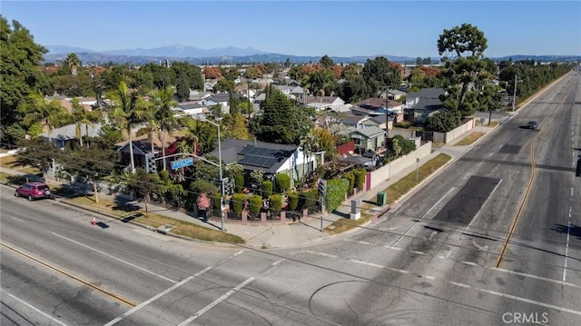 birds eye view of property featuring a mountain view