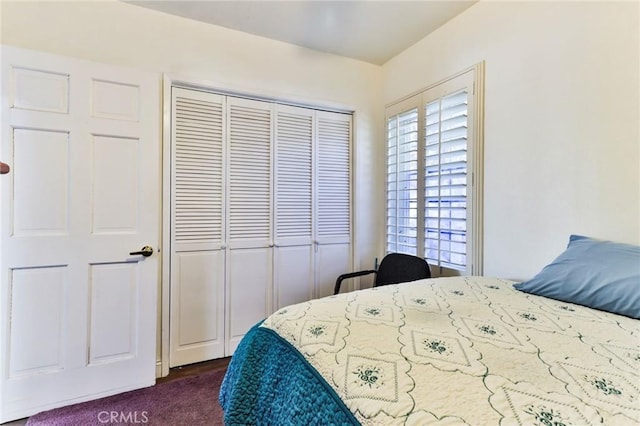 carpeted bedroom featuring a closet