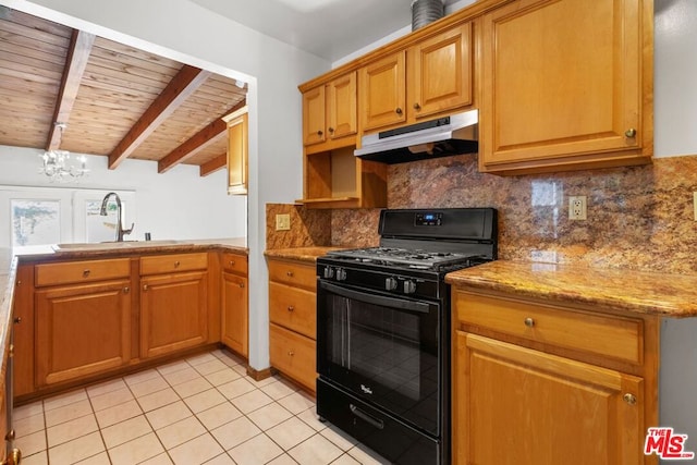 kitchen with wood ceiling, a chandelier, beam ceiling, black gas stove, and light stone counters