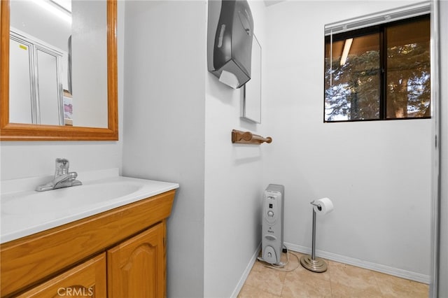 bathroom with tile patterned floors and vanity