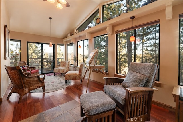 sunroom / solarium featuring ceiling fan and lofted ceiling