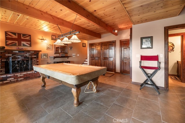 playroom with beam ceiling, a brick fireplace, wooden ceiling, and billiards