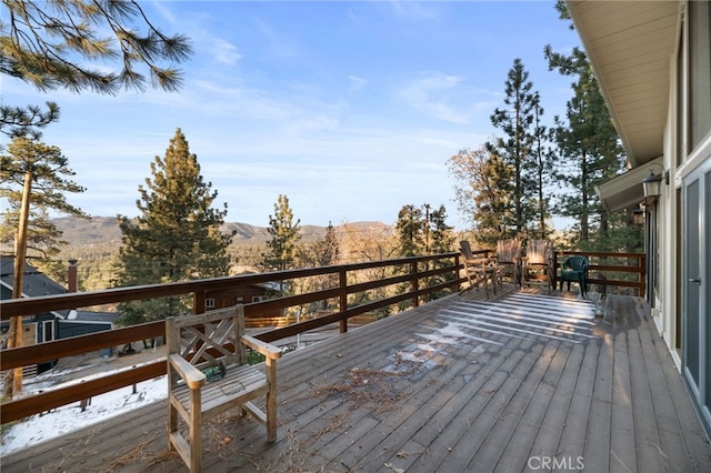 wooden deck with a mountain view