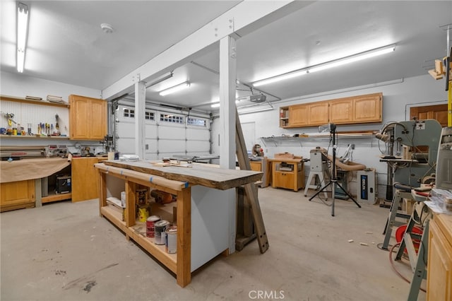 interior space featuring a workshop area and a garage door opener