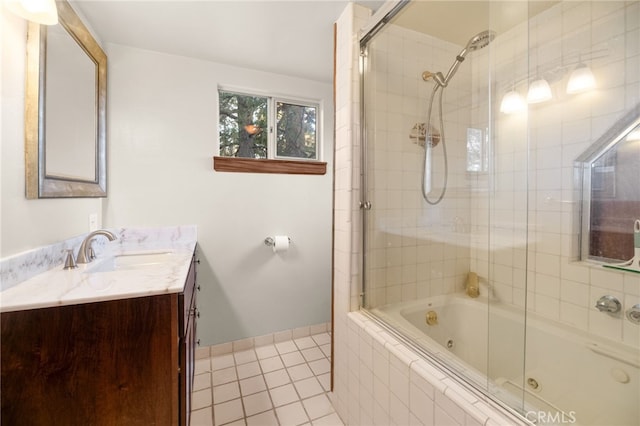 bathroom with vanity, tile patterned floors, and bath / shower combo with glass door