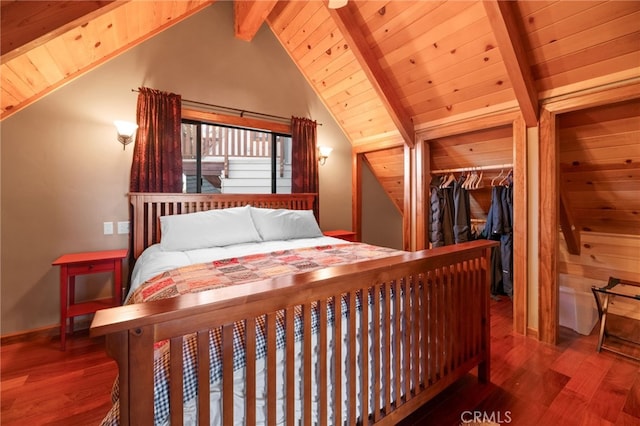 bedroom featuring wood ceiling, a closet, lofted ceiling with beams, and hardwood / wood-style flooring